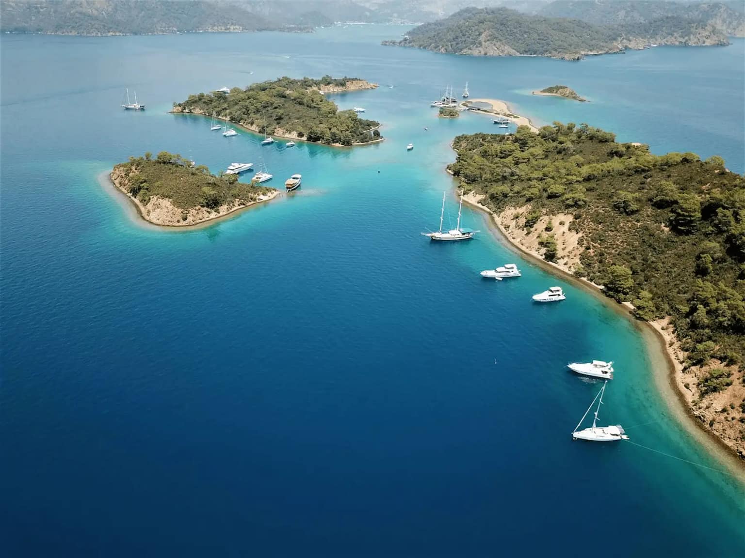 A classic wooden gulet anchored in a calm bay in Bozburun.