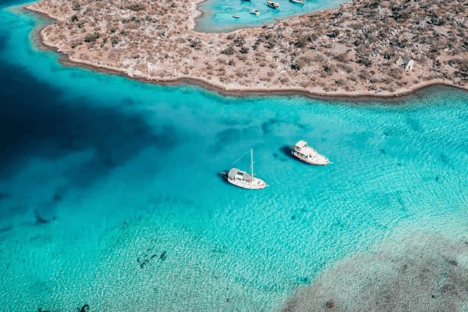 Luxury sailing yachts and gulets anchored in Akvaryum Bay.